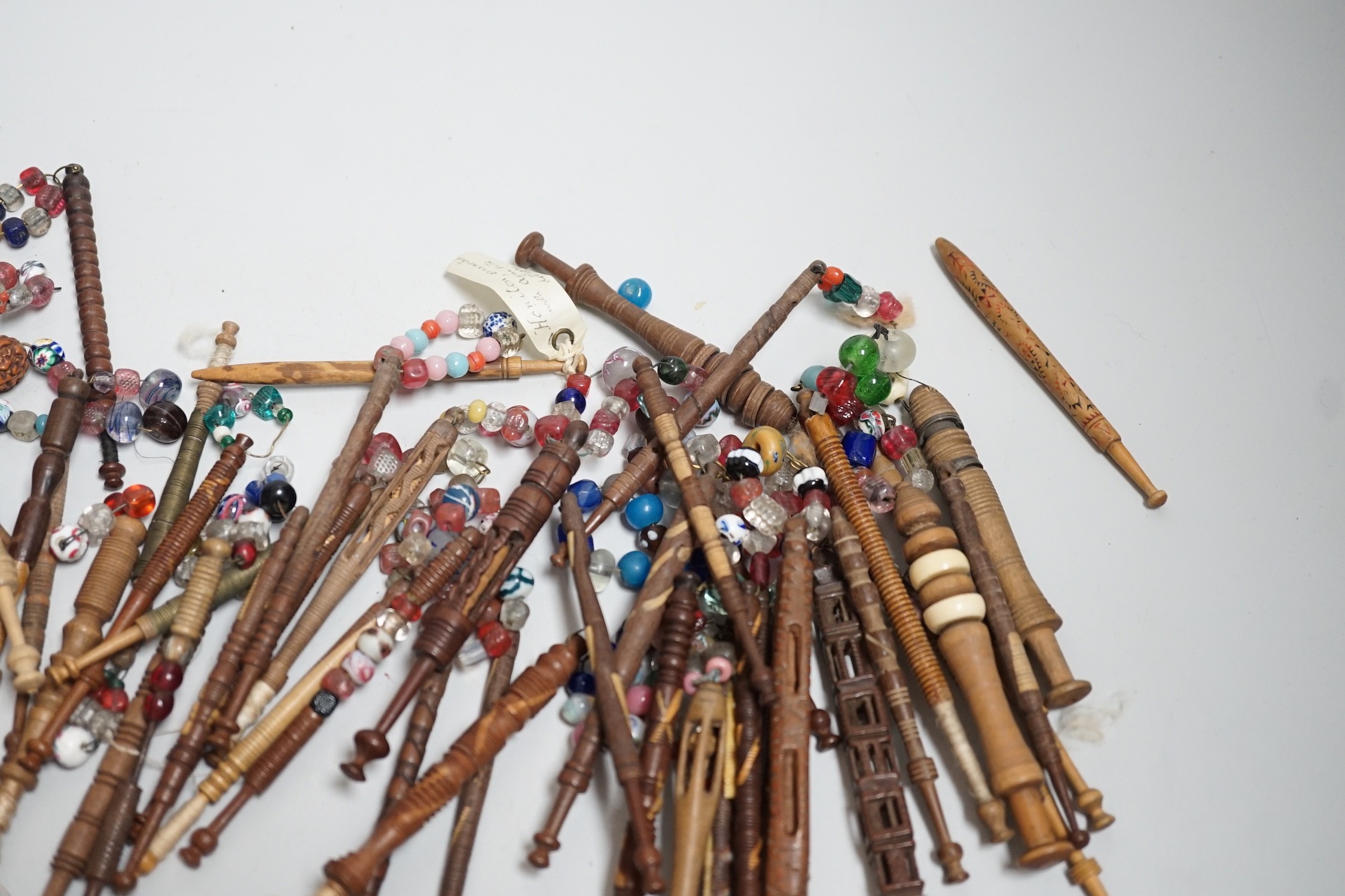 Fifty 19th century finely turned wooden lace bobbins with beaded ends together with 35 ornate wooden bobbins with beaded ends and 5 plain wooden bobbins unleaded (90)